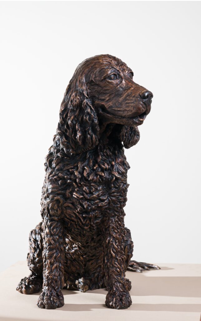 The life sized statue of a dog, a spaniel  by the Sculptress JOEL