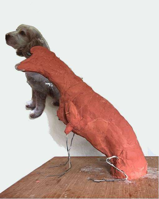 Dog statue in clay stage work continues by Sculptress Joel