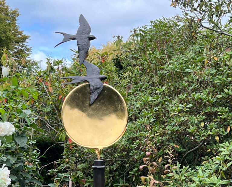 Swallow bronzes on gold sun by Sculptress Joel Walker a beautiful feature for a garden or landscape