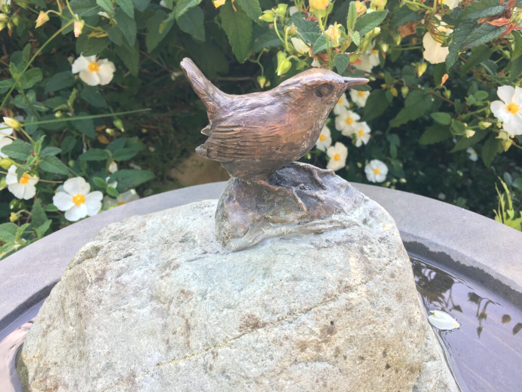 Bronze Wren on a Rock as Bird Bath feature for garden by Sculptress Joel