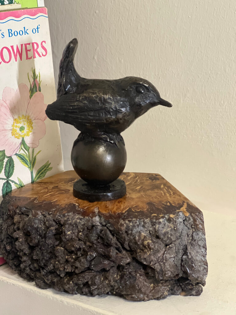 Bird Sculpture Wren Bronze by Sculptress JOEL set on a piece of Pippy Oak as a book-end