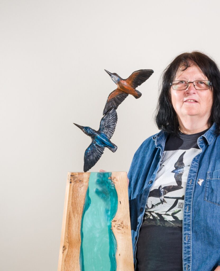 Sculptress JOEL and interior design sculpture of Bronze Kingfishers and Waterfall panel