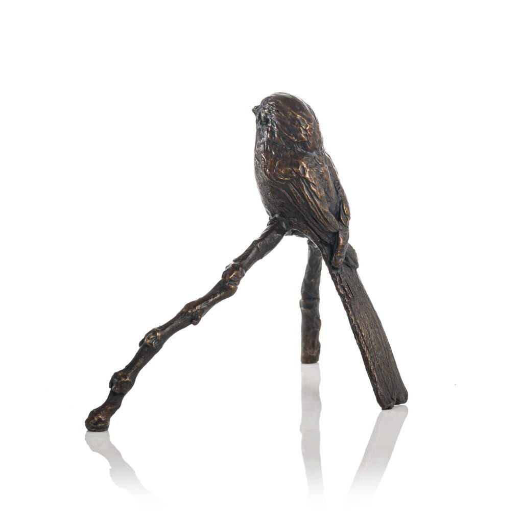 Long tailed tit delightful bird species by Sculptress JOEL cast in bronze a single young bird in side view making a great gift