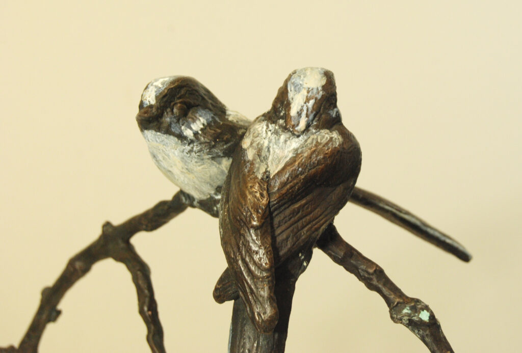 Close up of the pair of Long tailed tit the delightful bird species by Sculptress JOEL cast in bronze
