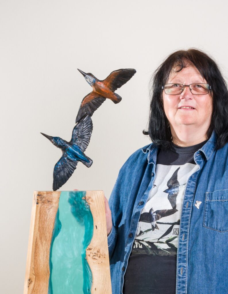 Sculptress JOEL with Interior design installation of a Waterfall in wood and resin and a pair of bronze kingfishers
